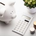 Piggy Bank and Calculator at Alman Partners