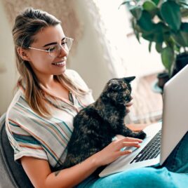 Women and cat at laptop