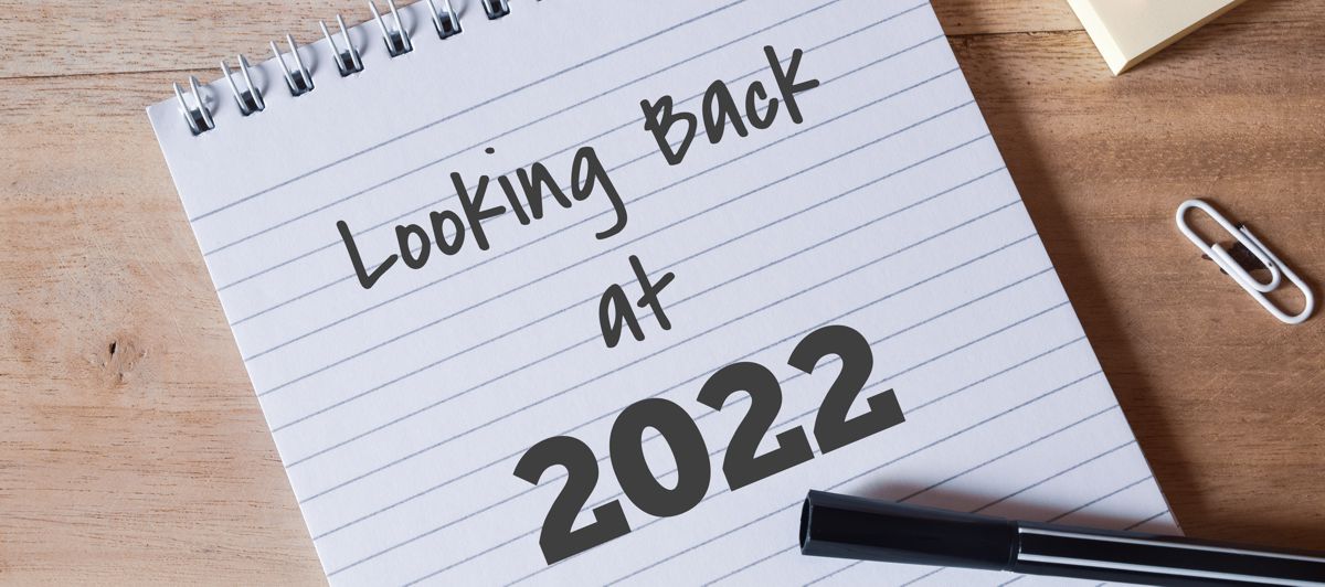 Notebook with Looking back at 2022 written on it at Alman Partners Truewealth