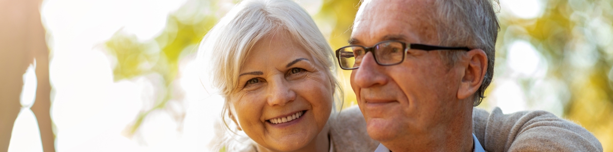 Retired couple hugging - Increase to Age Pension Access Age at Alman Partners True Wealth