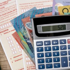 Australian dollars with calculator and tax form